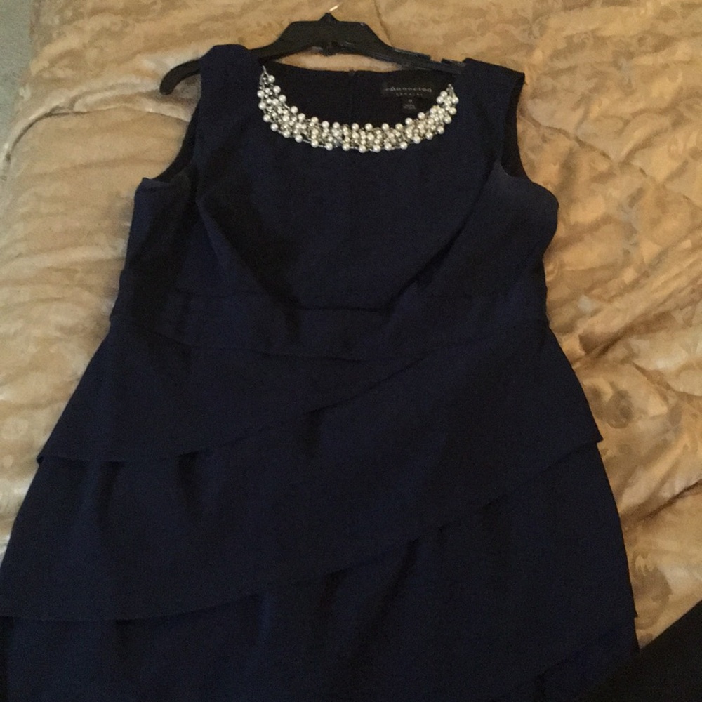Navy blue dress adorned w/ pearls at the neckline